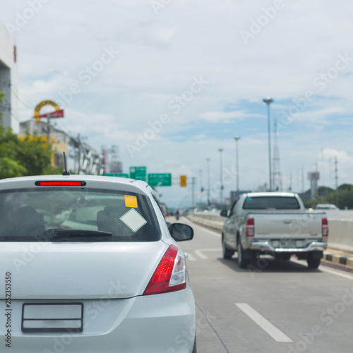 car on road traffic jam with blank sign sticker on back for design your text © sutichak