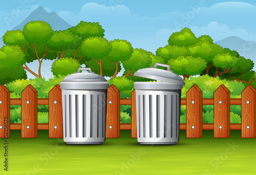 Two trash can in a clean park