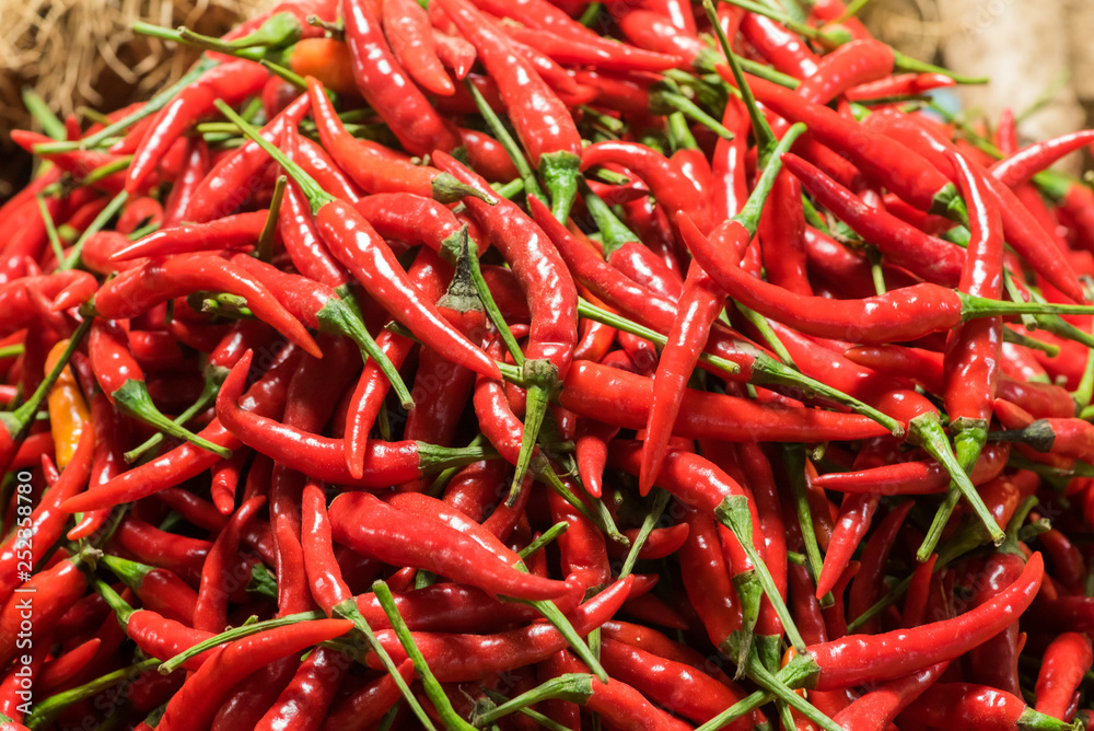Heap of red chili pepper in a basket in a market