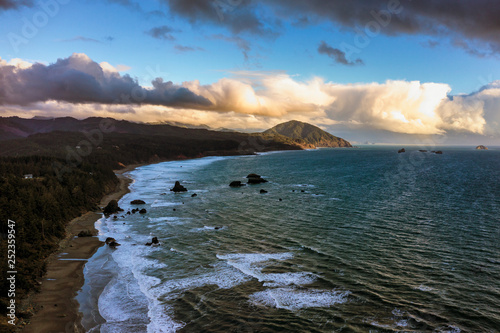 Drone image of Oregon Coast and Humbug Mountain in Port Orford, dramatic cloudscape photo