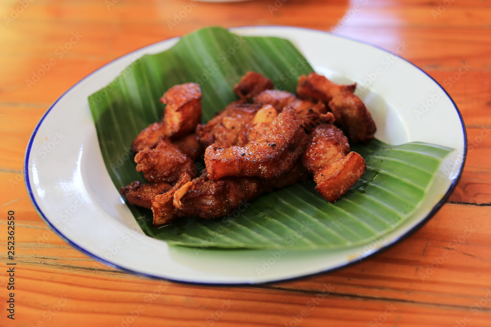 Deep fried pork belly with fish sauce.