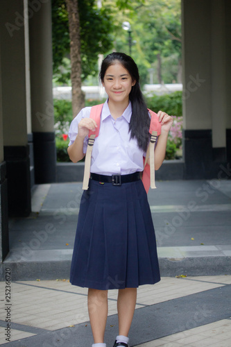 Portrait of thai high school student uniform teen beautiful girl happy and relax