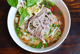 Fresh hot pho soup in a white bowl from traditional Vietnamese cuisine