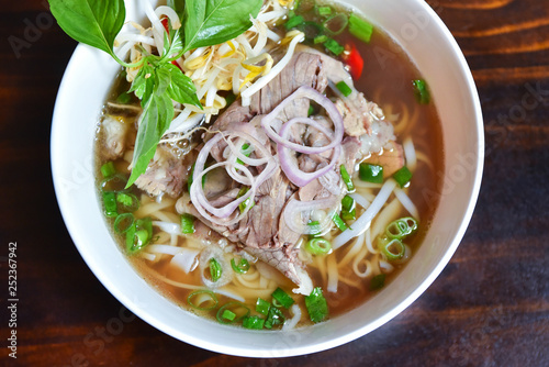 Fresh hot pho soup in a white bowl from traditional Vietnamese cuisine