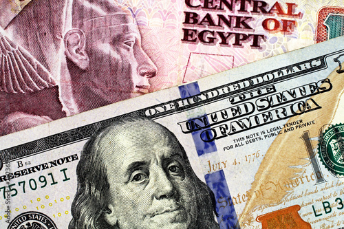 Wallpaper Mural An Egyptian ten pound bank note with a blue American one hundred dollar bill Torontodigital.ca