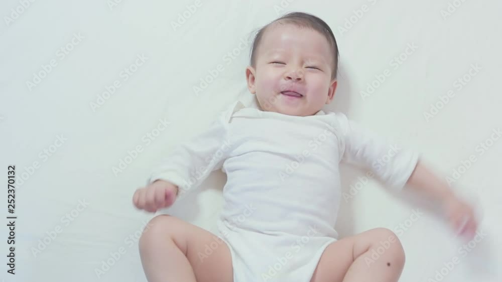 Newborn slepping and playing on the bed, New family and mom protection concept Newborn slepping and playing on the bed, New family and mom protection concept