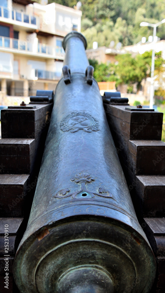 ancient cannon turned towards building