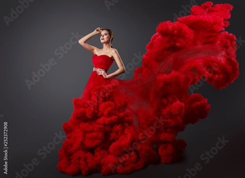 Woman in Red Ruching Dress, Fashion Model in Cloud Gown with Long Waving Flying Tail