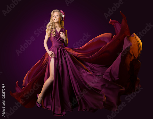Woman Flying Purple Dress, Fashion Model Dancing in Long Waving Gown, Fluttering Fabric on Wind