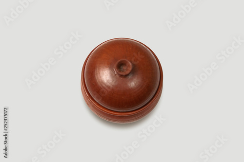 Glazed ceramic pot with lid on soft gray background.high resolution photo.