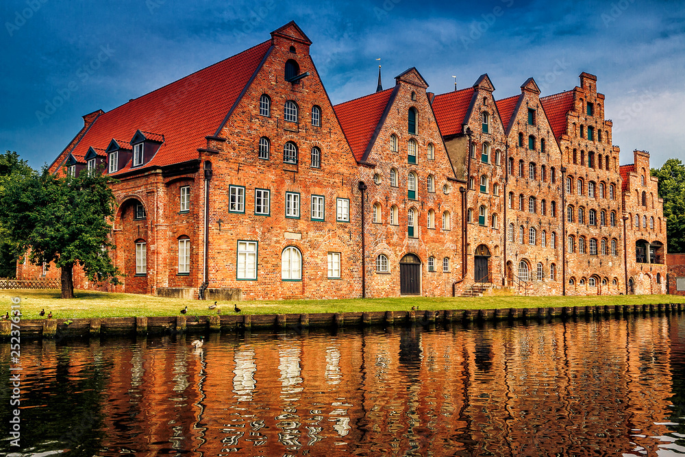 Fototapeta premium The Salzspeicher (salt storehouses), six historic brick buildings on the Upper Trave River in Luebeck, Schleswig-Holstein, northern Germany.