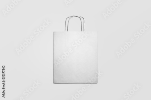 White paper shopping bag Mock-up on soft gray background.Сan be used for design and branding
