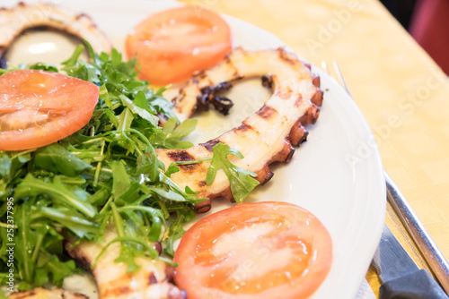 Octopus salad with rocket and tomatoes