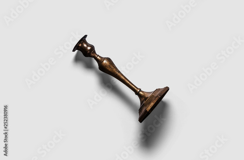 Vintage brass stand holder isolated on soft gray background.Top view.