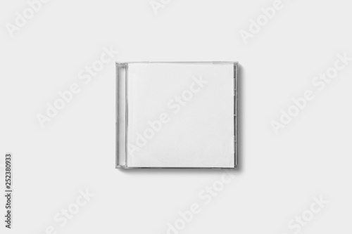 Closed compact plastic disc box case with white isolated blank for branding design. CD jewel mock-up on soft gray background.