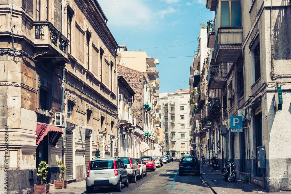 Beautiful cityscape of Italy, historical street of Catania, Sicily, facade of old buildings.