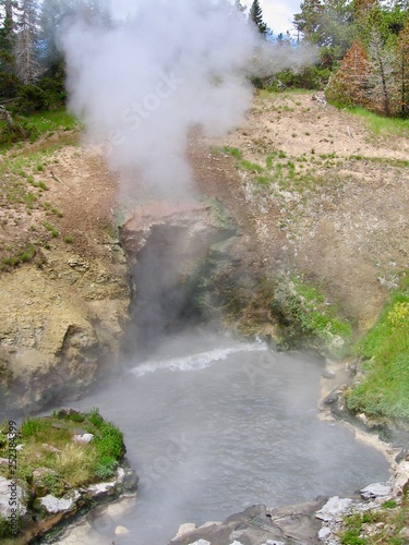 Dragon's Mouth geothermal activity of steam and hot water in Yellowstone National Park in Wyoming, United States. 