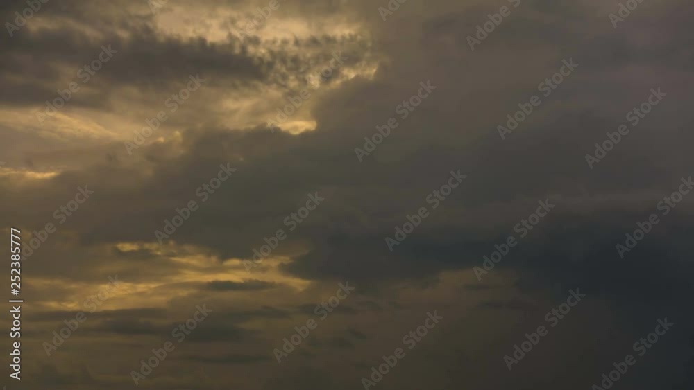 Golden twilight sky with gloomy clouds moving and rolling. 4k time lapse footage. Golden twilight sky with gloomy clouds moving and rolling. 4k time lapse footage.