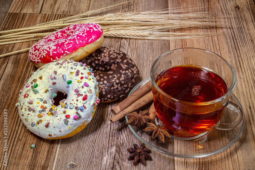 Fototapeta premium Glazed donuts with tea