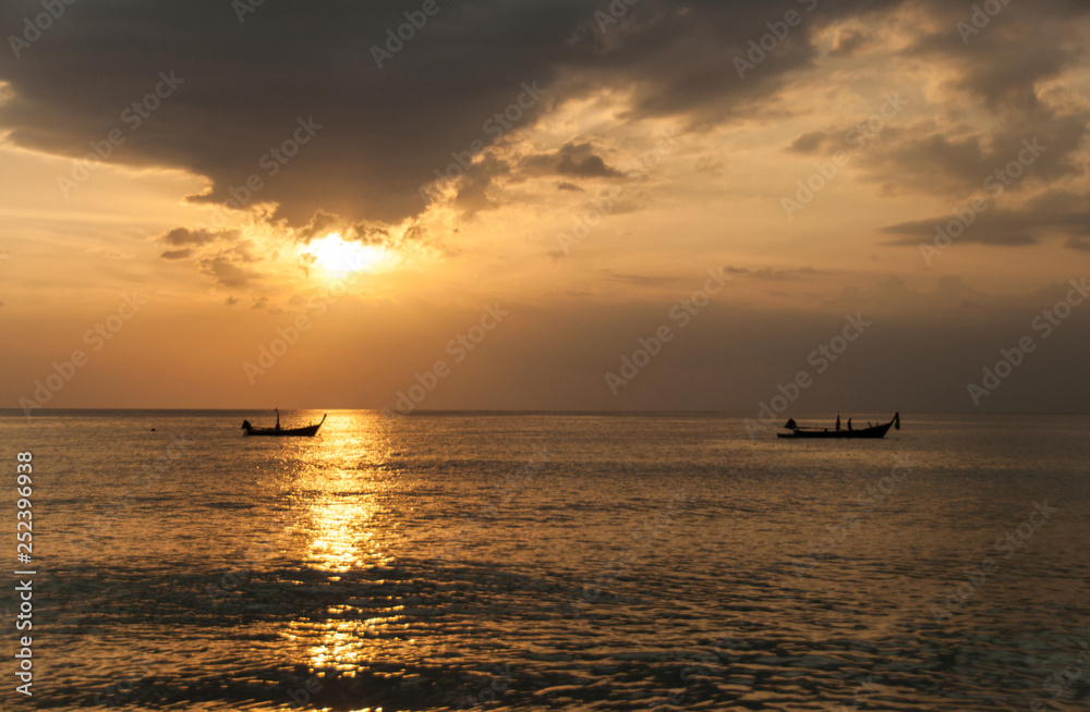 Sunset on the Naithon beach on Phuket in Thailand