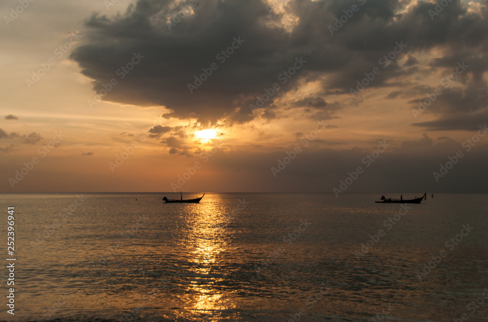 Sunset on the Naithon beach on Phuket in Thailand Sunset on the Naithon beach on Phuket in Thailand