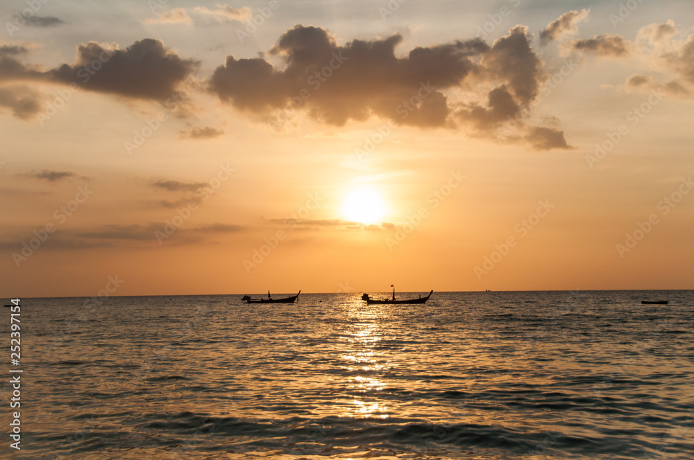 Sunset on the Naithon beach on Phuket in Thailand