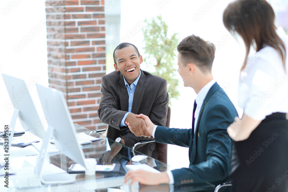 handshake international business partners on a Desk handshake international business partners on a Desk