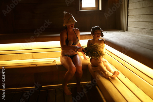 Mother and son in steam room