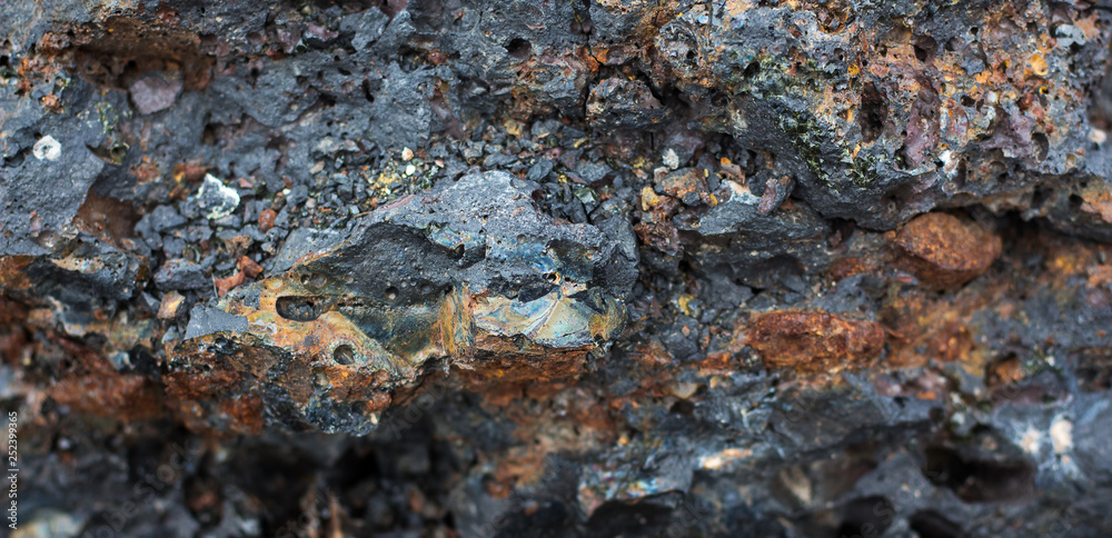 The texture of dark stones of volcanic origin_ The texture of dark stones of volcanic origin_