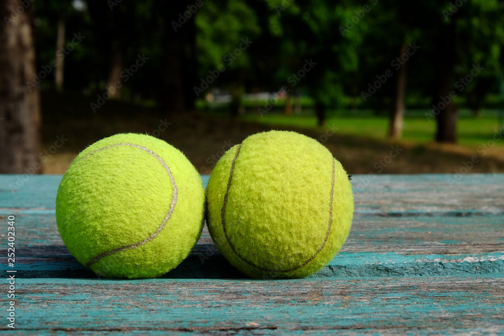 tennis ball on wooden