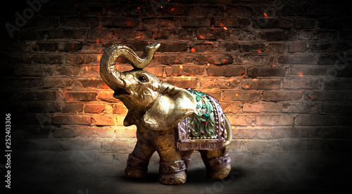 Golden elephant on a wooden...