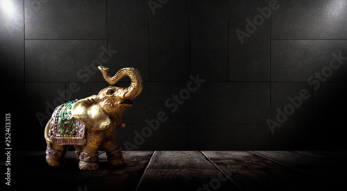 Golden elephant on a wooden...