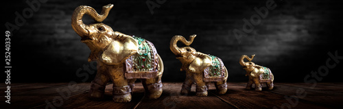 Golden elephant on a wooden...