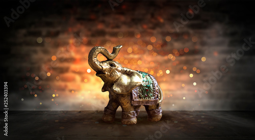 Golden elephant on a wooden...