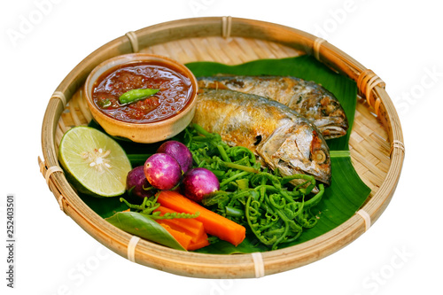 Nam prig Kapi is shrimp paste mix chili sauce served with boiled and fresh vegetables the table.