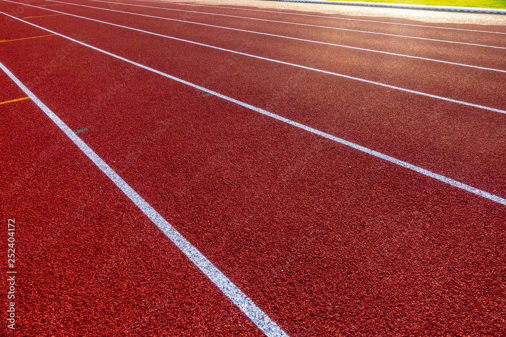 Red running track in stadium