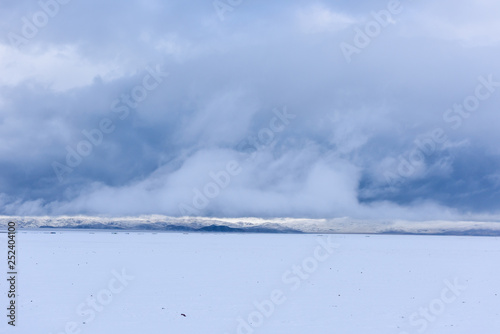 snow scene of the lake Namtso ( or Lake Nam; Nam Co), which is a mountain lake in Damxung(Dangxiaong) County, Lhasa, Tibet, China, lies on the west side of the  Nyenchen Tanglha Mountains. photo