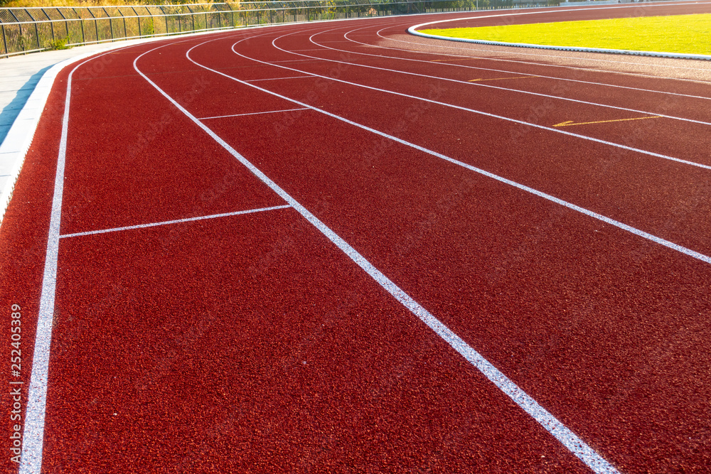 Fototapeta premium Red running track in stadium