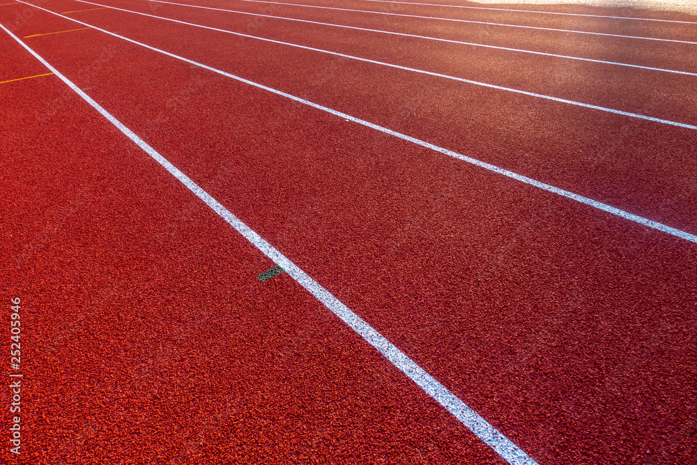 Red running track in stadium