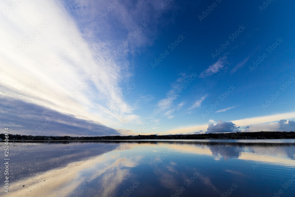 Beautiful vista of the twilight sky reflecting off the surface of Red Wharf Bay, Anglesey, North Wales
