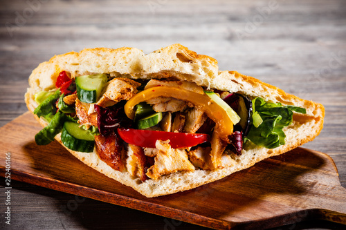 Kebab - grilled meat and vegetables on wooden background