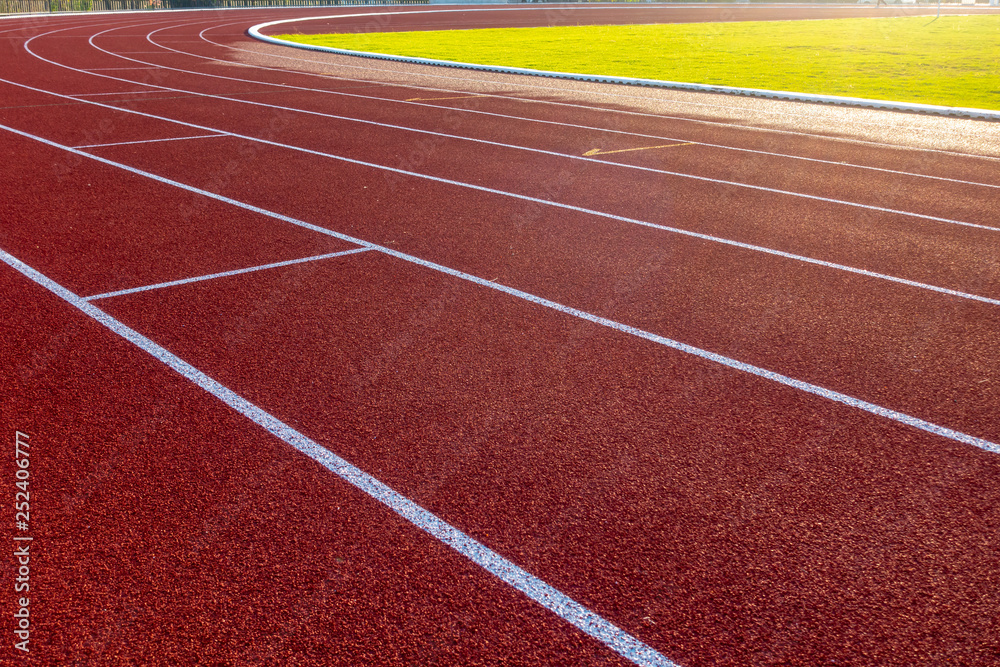 Fototapeta premium Red running track in stadium