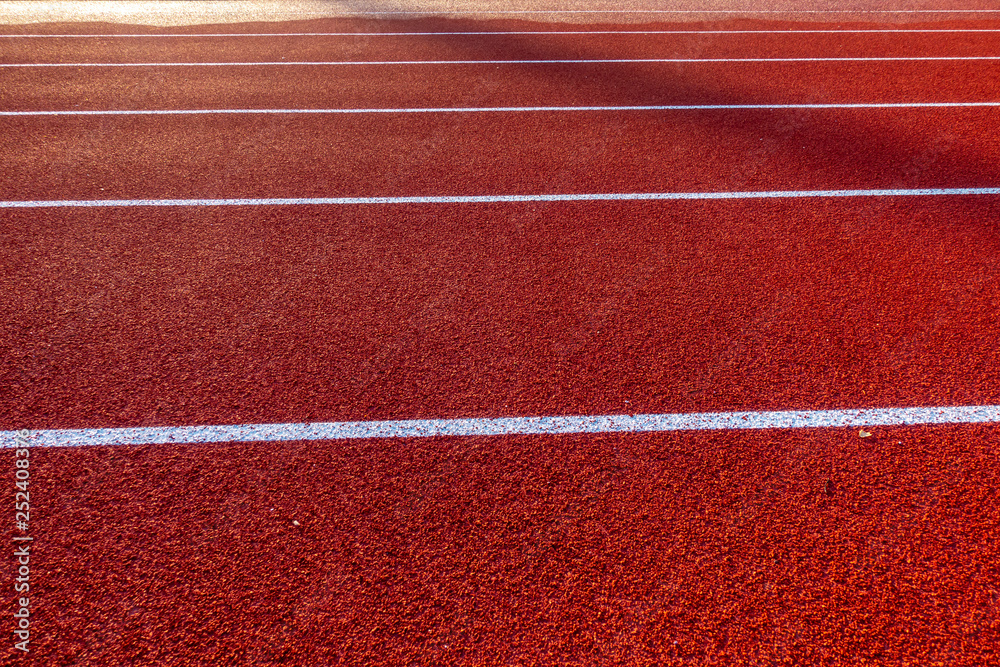 Fototapeta premium Red running track in stadium