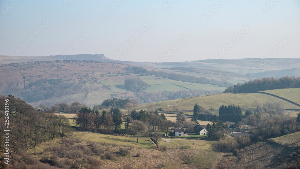 Lovely landscape image of the Peak District in England on a hazy Winter day viewed from the lower slopes of Bamford Edge