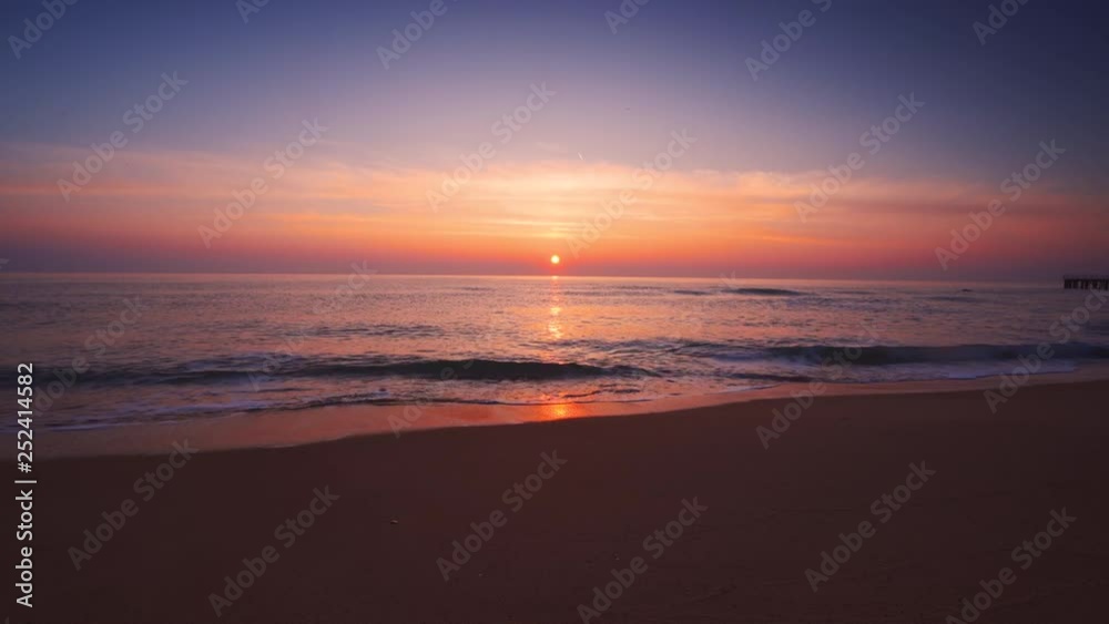 Ocean beach sunrise with sky, colorful clouds and sun rays, video Ocean beach sunrise with sky, colorful clouds and sun rays, video