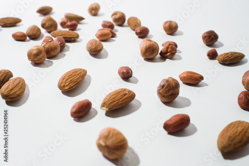 Pattern of nuts mix with copy space. Various nuts isolated on white.