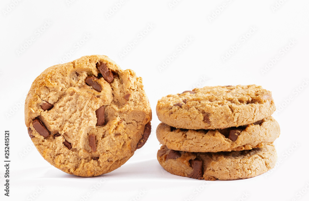 Chocolate chip cookies stacked on white background. Chocolate chip cookies stacked on white background.
