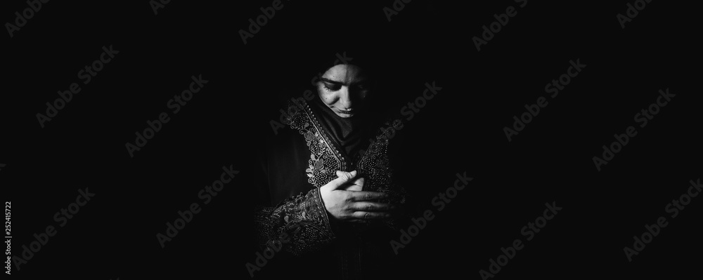 Young muslim girl reading a holy book Young muslim girl reading a holy book