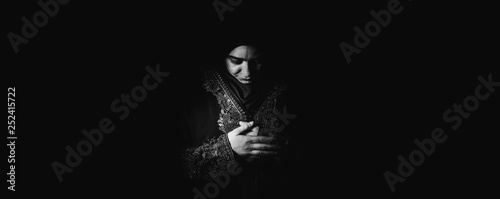 Young muslim girl reading a holy book © seriff