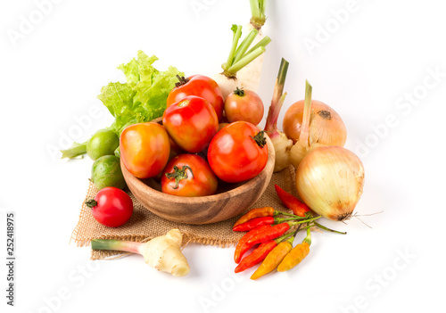 Fototapeta Naklejka Na Ścianę i Meble -  Fruits and vegetables in wooden bowl on white background
